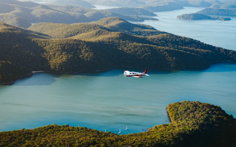 Plane over harbor